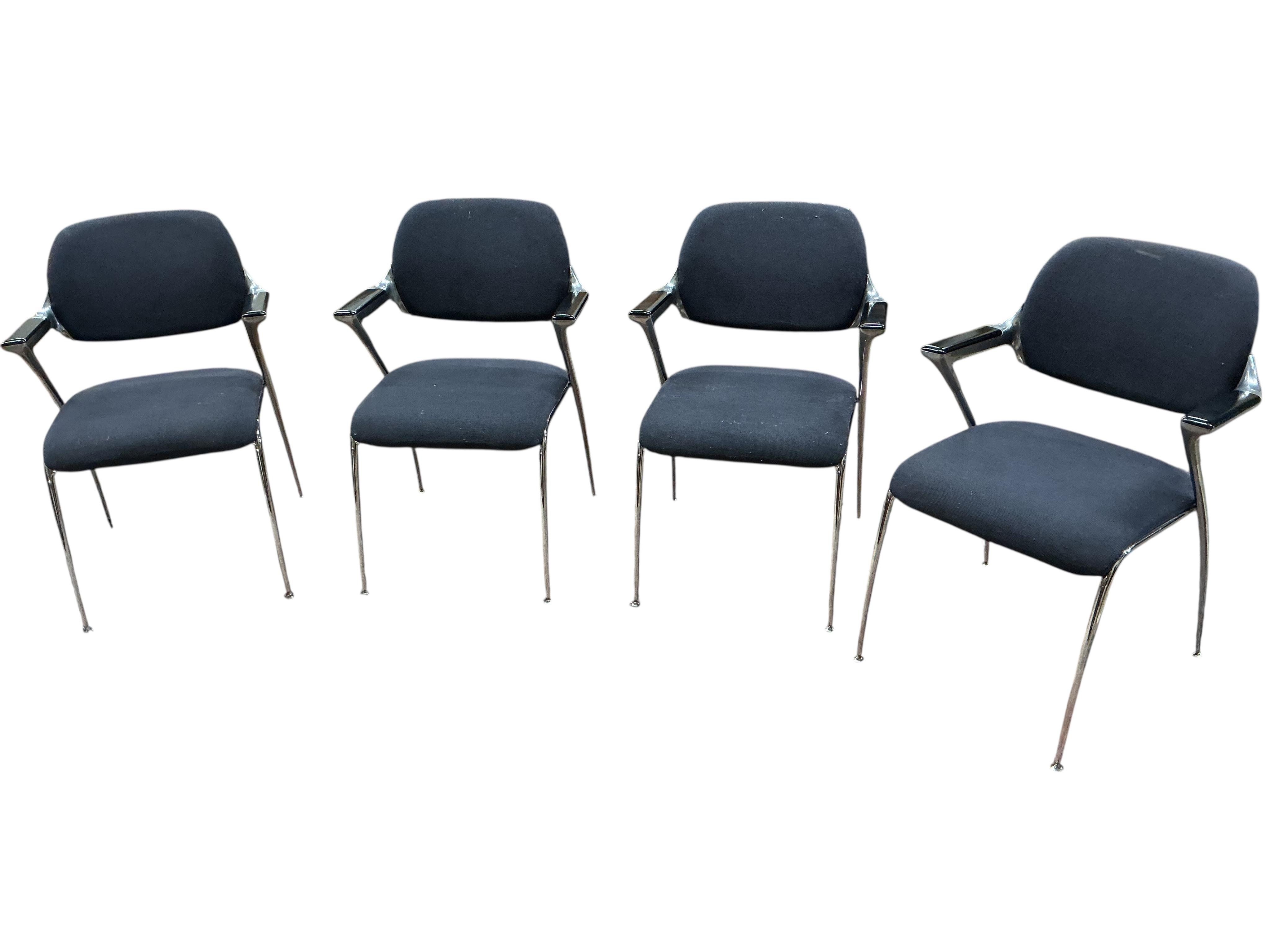 A set of four Brunner mid century upholstered chrome elbow chairs